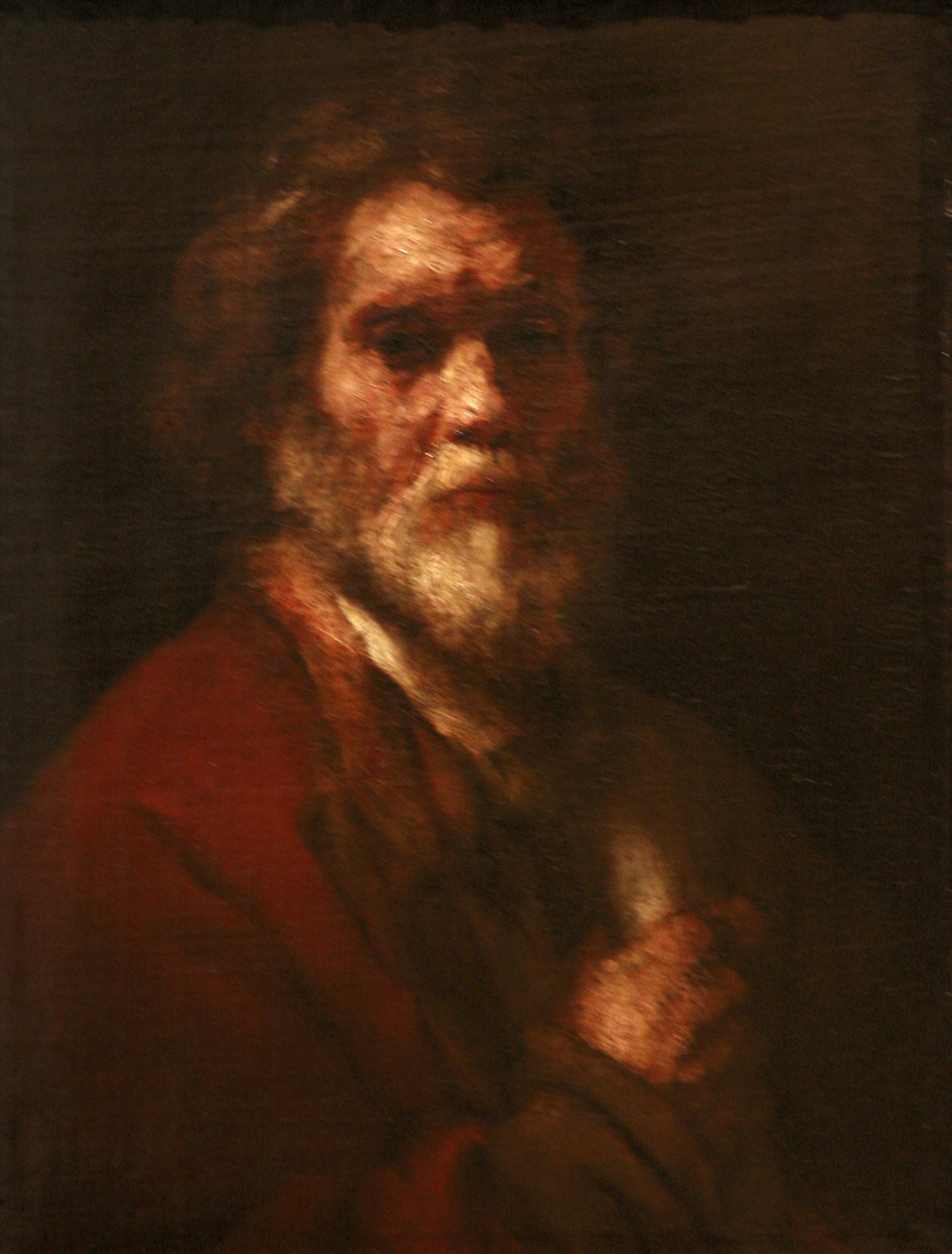 Man of about 55 holding a Roll of Paper in his Right Hand