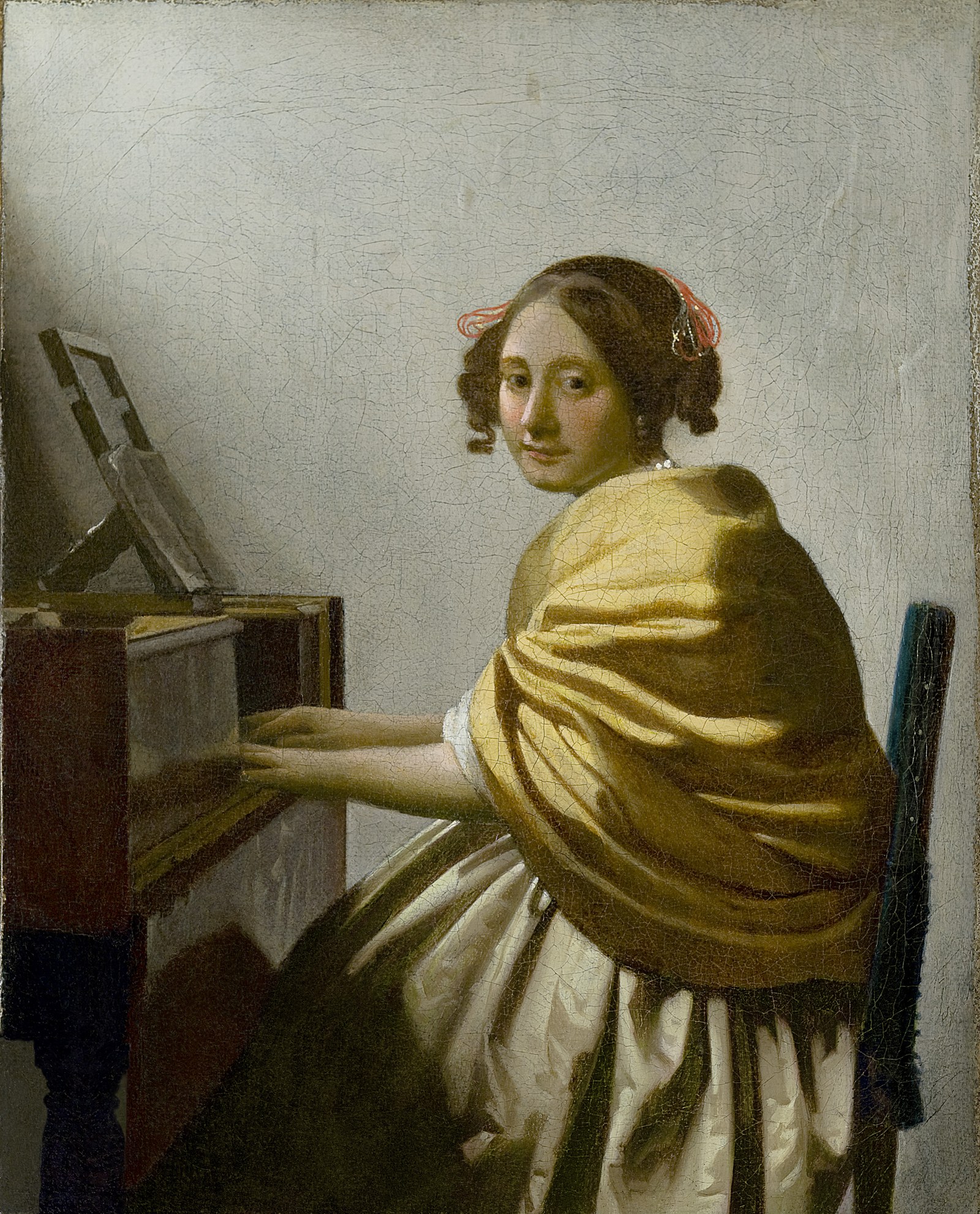 A Young Woman Seated at the Virginals