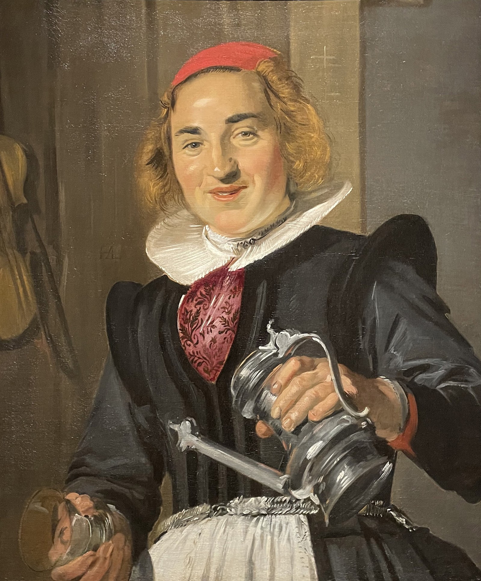 A young woman with a glass and flagon