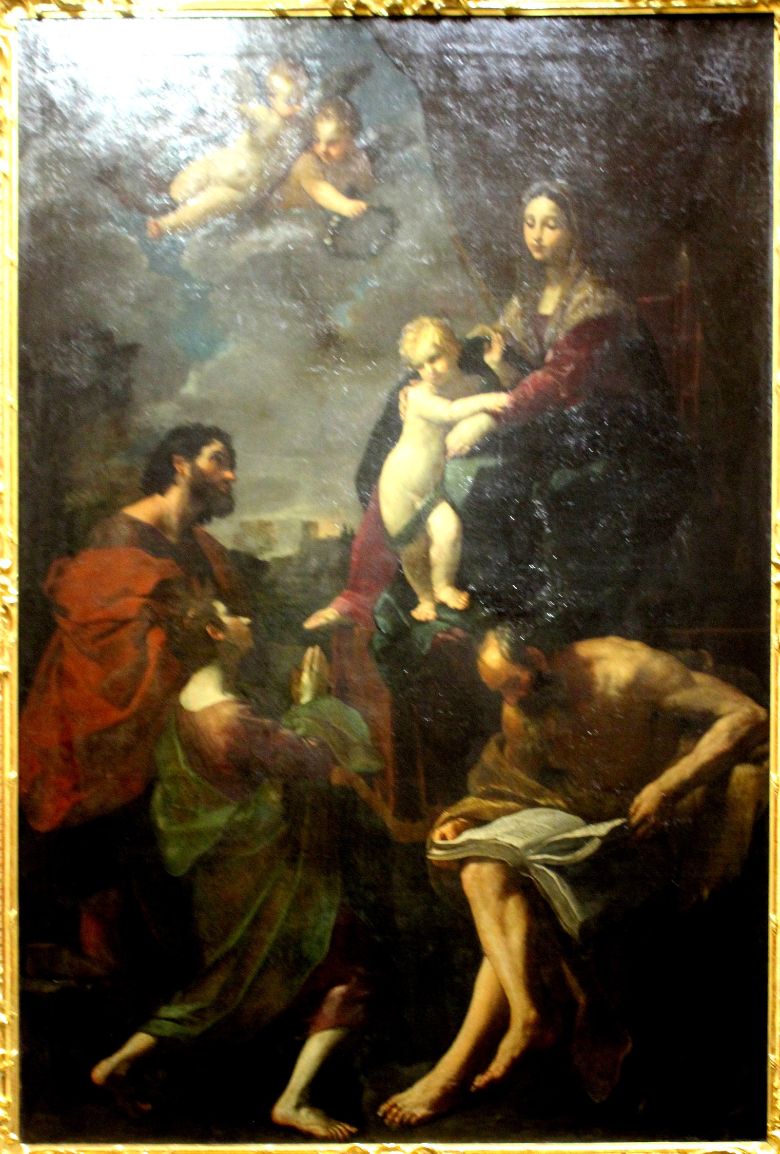 Madonna and Child enthroned with three saints