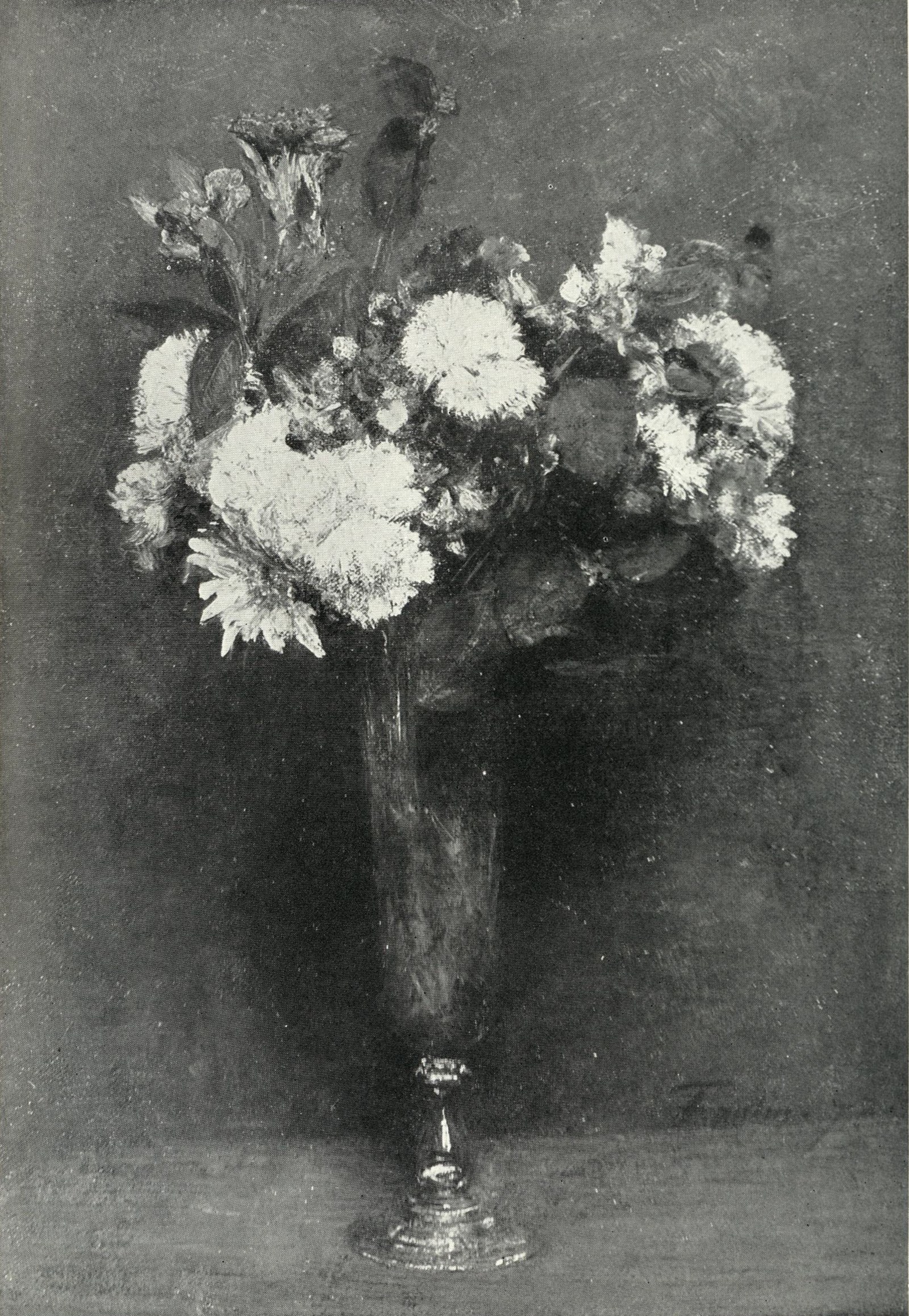 A bouquet of mixed flowers in a glass vase