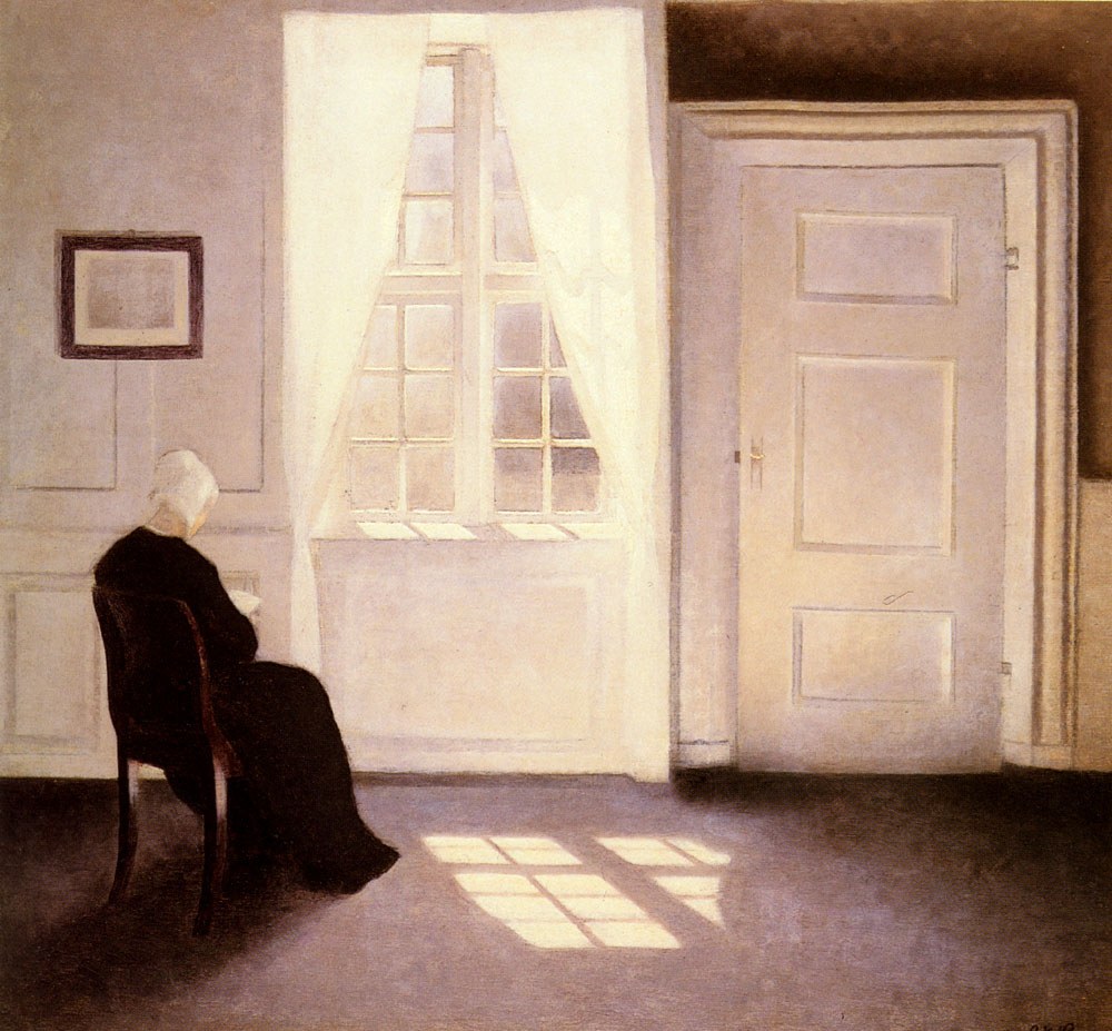 A Woman Reading by a Window