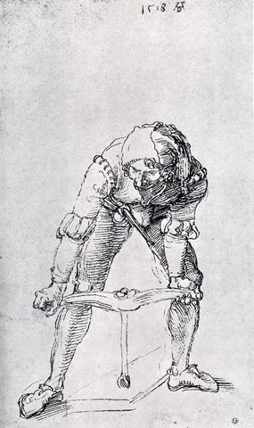 Young Man Leaning Forward And Working With A Large Drill