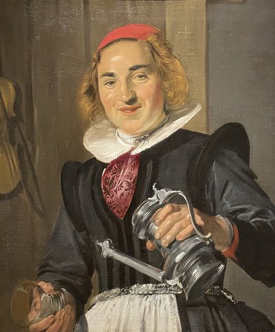 A young woman with a glass and flagon