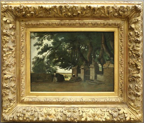 Breton landscape. A gate shaded by tall trees