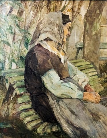 Old woman sitting on a bench in Céleyran
