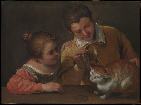 Two children teasing a cat