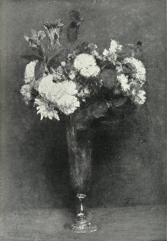 A bouquet of mixed flowers in a glass vase