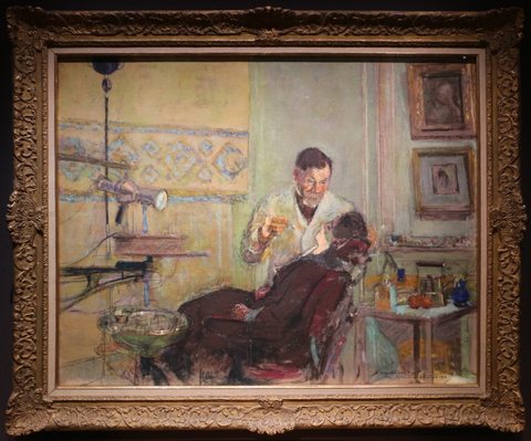 Dr. George Viau in his dental office