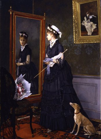 Elegant Woman Looking at Herself in a Mirror