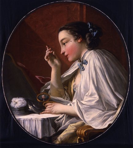 A Lady Applying a Beauty Spot